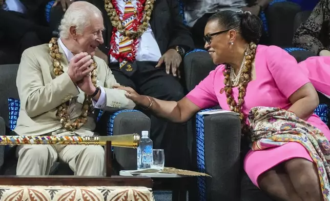 Britain's King Charles and CHOGM Secretary General Patricia Scotland talk during the opening ceremony for the Commonwealth Heads of Government meeting in Apia, Samoa, Friday, Oct. 25, 2024. (AP Photo/Rick Rycroft/Pool)