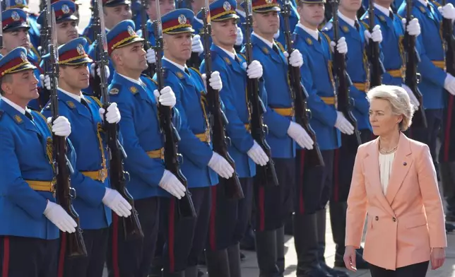 European Commission President Ursula von der Leyen reviews the honor guard with Serbian President Aleksandar Vucic during a welcome ceremony at the Serbia Palace in Belgrade, Serbia, Friday, Oct. 25, 2024. (AP Photo/Darko Vojinovic)