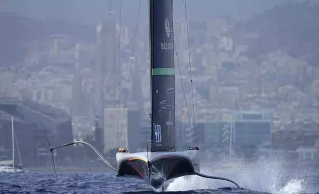 Ineos Britannia races against Emirates Team New Zealand during the Louis Vuitton 37th America's Cup Day 4 race 6 in Barcelona, Spain, Wednesday, Oct. 16, 2024. (AP Photo/Bernat Armangue)