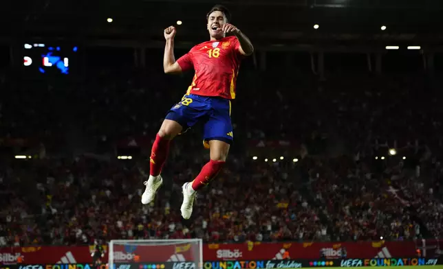 Spain's Martín Zubimendi celebrates after scoring the opening goal during the UEFA Nations League group 4 soccer match between Spain and Denmark in Murcia, Spain, Saturday, Oct. 12, 2024. (AP Photo/Jose Breton)