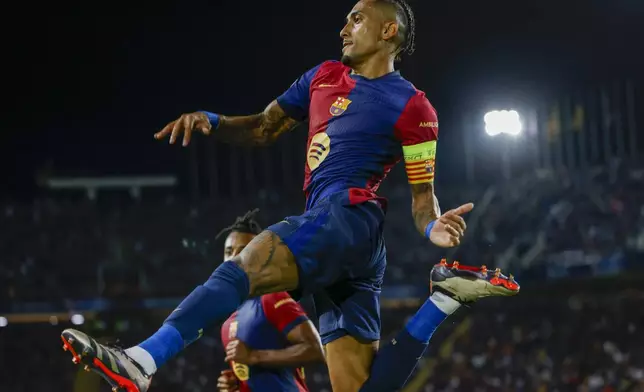 Barcelona's Raphinha celebrates after scoring his side's second goal during the Champions League soccer match between Barcelona and Young Boys at the Lluis Companys Olympic Stadium in Barcelona, Spain, Tuesday, Oct. 1, 2024. (AP Photo/Joan Monfort)