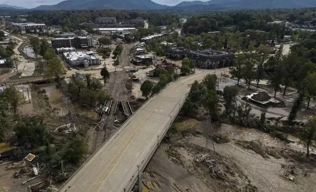 Debris is seen in the aftermath of Hurricane Helene, Monday, Sept. 30, 2024, in Asheville, N.C. (AP Photo/Mike Stewart)