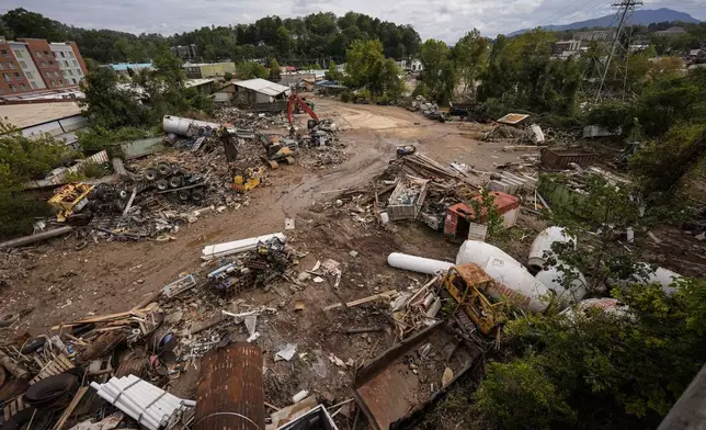 Debris is seen in the aftermath of Hurricane Helene, Monday, Sept. 30, 2024, in Asheville, N.C. (AP Photo/Mike Stewart)