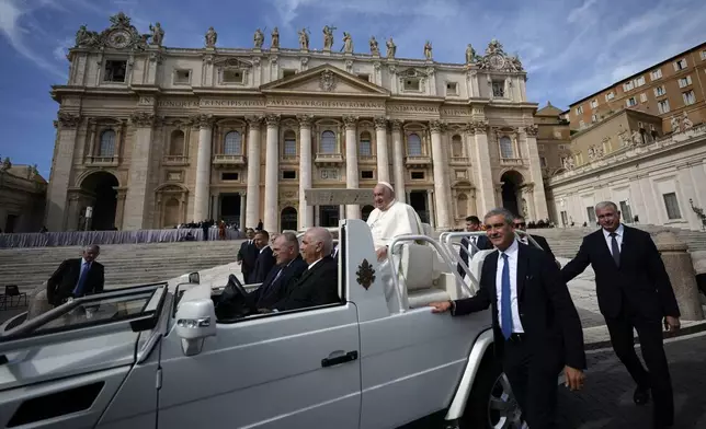 Pope Francis leaves at the end of his weekly general audience in St. Peter's Square at the Vatican, Wednesday, Oct. 9, 2024. (AP Photo/Andrew Medichini)