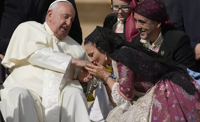 Pope Francis meets Spain's faithful at the end of his weekly general audience in St. Peter's Square, at the Vatican, Wednesday, Oct. 9, 2024. (AP Photo/Andrew Medichini)