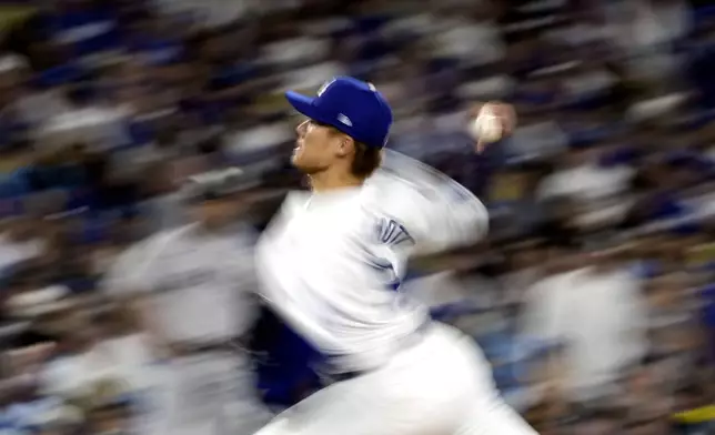 Los Angeles Dodgers starting pitcher Yoshinobu Yamamoto throws against the New York Yankees during the fifth inning in Game 2 of the baseball World Series, Saturday, Oct. 26, 2024, in Los Angeles. (AP Photo/Godofredo A. Vásquez)