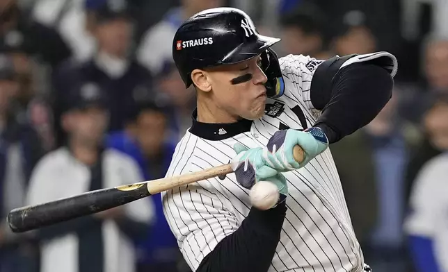 New York Yankees' Aaron Judge is hit by a pitch thrown by Los Angeles Dodgers pitcher Daniel Hudson during the third inning in Game 4 of the baseball World Series, Tuesday, Oct. 29, 2024, in New York. (AP Photo/Godofredo A. Vásquez)