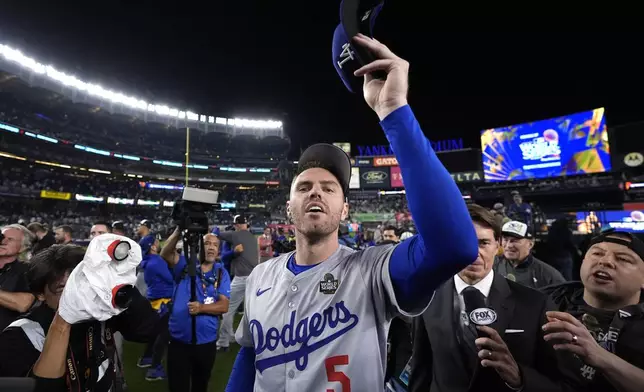 Los Angeles Dodgers' Freddie Freeman celebrates after the Dodgers beat the New York Yankees in Game 5 to win the baseball World Series, Wednesday, Oct. 30, 2024, in New York. (AP Photo/Godofredo A. Vásquez)