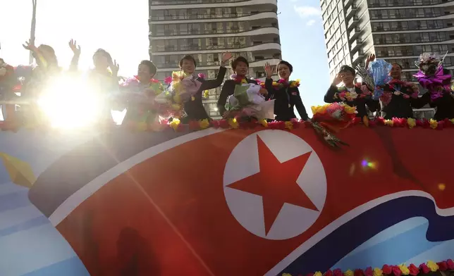 North Korea women's football team members wave to the crowd in Pyongyang, after they won the FIFA U-20 Women's World Cup held in Colombia, Saturday, Sept. 28, 2024. (AP Photo/Jon Chol Jin)