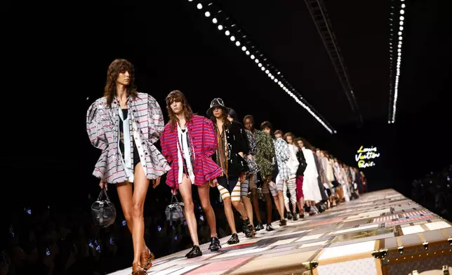 Models wear creations as part of the Louis Vuitton Spring/Summer 2025 collection presented Tuesday, Oct. 1, 2024, in Paris. (Photo by Vianney Le Caer/Invision/AP)