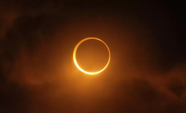 The moon moves past the sun during an annular solar eclipse in Puerto San Julian, Argentina, Wednesday, Oct. 2, 2024. (AP Photo/Natacha Pisarenko)