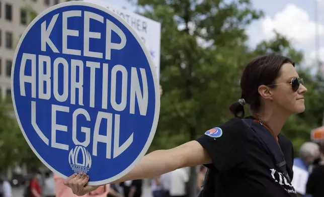 FILE - An. Abortion rights demonstrator holds a sign during a rally on May 14, 2022, in Chattanooga, Tenn. (AP Photo/Ben Margot, File)