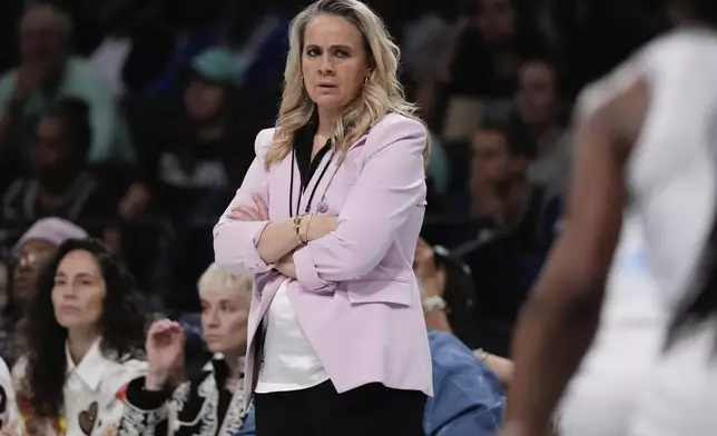 Las Vegas Aces head coach Becky Hammon watches during the first half of a WNBA basketball semifinal game against the New York Liberty, Tuesday, Oct. 1, 2024, in New York. (AP Photo/Frank Franklin II)