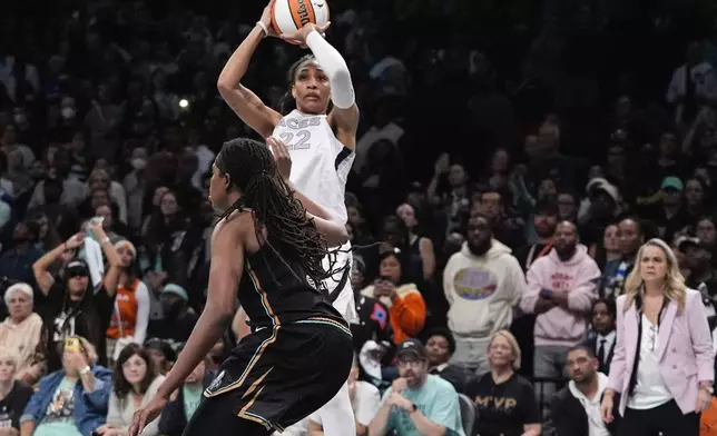 Las Vegas Aces' A'ja Wilson shoots over New York Liberty's Jonquel Jones during the second half of a WNBA basketball semifinal game, Tuesday, Oct. 1, 2024, in New York. The Liberty won 88-84. (AP Photo/Frank Franklin II)