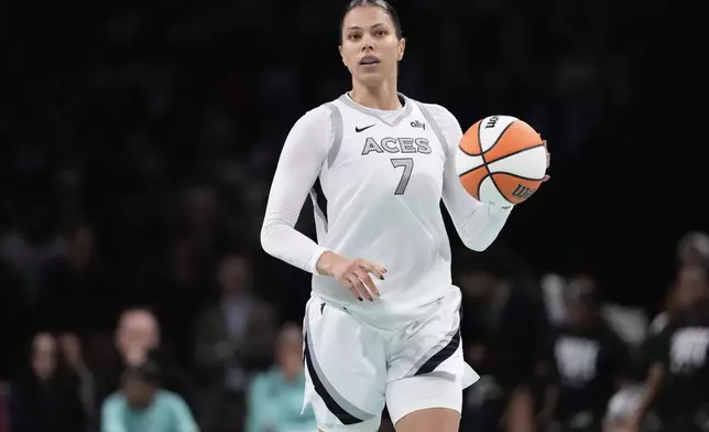 Las Vegas Aces' Alysha Clark (7) looks to pass during the second half of a WNBA basketball semifinal game against the New York Liberty, Tuesday, Oct. 1, 2024, in New York. The Liberty won 88-84. (AP Photo/Frank Franklin II)