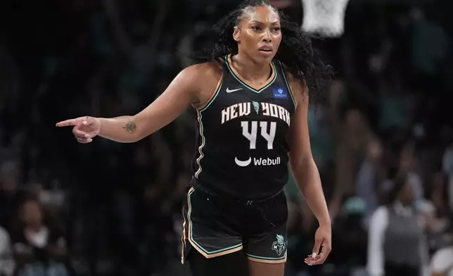 New York Liberty's Betnijah Laney-Hamilton (44) gestures to teammates after making a three-point shot during the first half of a WNBA basketball semifinal game against the Las Vegas Aces, Tuesday, Oct. 1, 2024, in New York. (AP Photo/Frank Franklin II)