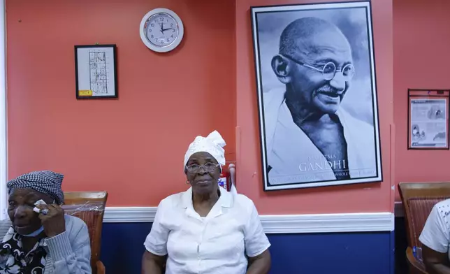 Haitian Theomene Valentine, 84, waits for lunch at Sunshine Adult Day Center in Bergenfield, N.J., Monday, Aug. 26, 2024. (AP Photo/Kena Betancur)