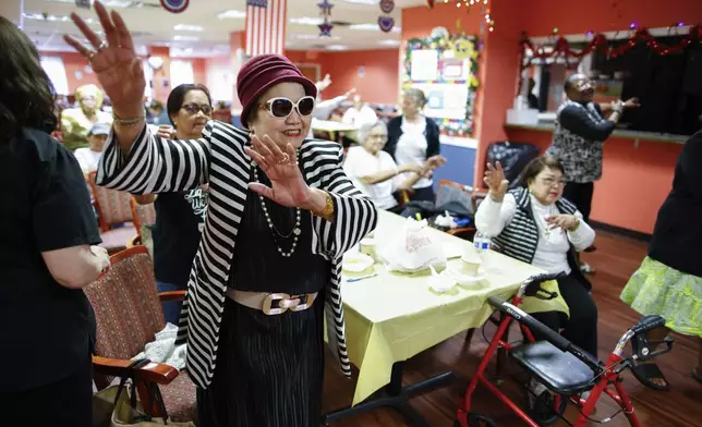 People attend a Zumba exercise class at Sunshine Adult Day Center in Bergenfield, N.J., Monday, Aug. 26, 2024. (AP Photo/Kena Betancur)