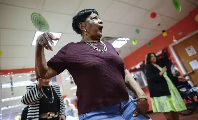 People attend a Zumba exercise class at Sunshine Adult Day Center in Bergenfield, N.J., Monday, Aug. 26, 2024. (AP Photo/Kena Betancur)