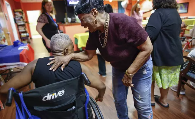 People attend a Zumba exercise class at Sunshine Adult Day Center in Bergenfield, N.J., Monday, Aug. 26, 2024. (AP Photo/Kena Betancur)