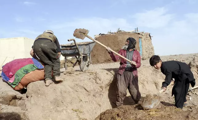 Survivors, makes a mud home is seen in Zinda Jan district, of Herat province, in western Afghanistan, Saturday, Sept. 28, 2024 following a 6.3 magnitude earthquake on Oct. 7, 2023. (AP Photo/Omid Haqjoo)