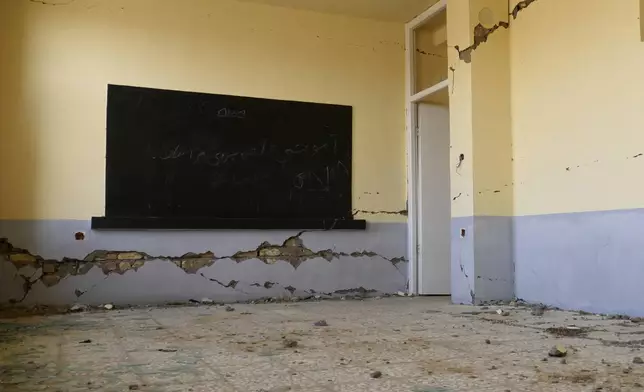 Damaged classroom is seen in Zinda Jan district, of Herat province, in western Afghanistan, Saturday, Sept. 28, 2024 destroyed by a 6.3 magnitude earthquake on Oct. 7, 2023. (AP Photo/Omid Haqjoo)