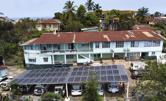 This photo released by Easy Solar shows a large solar panels installation on a rooftop of an office building in Freetown, Sierra Leone, Tuesday Aug. 13, 2024. (Muctarr Bah Mohamed/Easy Solar via AP)