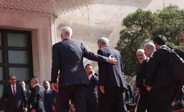 Prime Minister of Albania Edi Rama, left, escorts Turkey's President Recep Tayyip Erdogan before their meeting in Tirana, Albania, Thursday, Oct. 10, 2024. (AP Photo/Hameraldi Agolli)