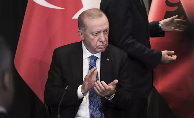 Turkey's President Recep Tayyip Erdogan claps hands during a news conference with Prime Minister of Albania Edi Rama, after after they sing bilateral agreements in Tirana, Albania, Thursday, Oct. 10, 2024. (AP Photo/Vlasov Sulaj) i