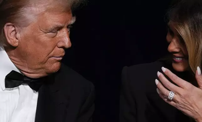 Republican presidential nominee former President Donald Trump talks with former first lady Melania Trump at the 79th annual Alfred E. Smith Memorial Foundation Dinner, Thursday, Oct. 17, 2024, in New York. (AP Photo/Julia Demaree Nikhinson)