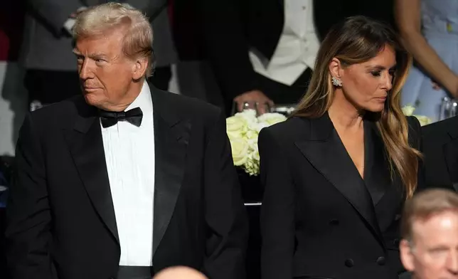 Republican presidential nominee former President Donald Trump and former first lady Melania Trump arrive for the 79th annual Alfred E. Smith Memorial Foundation Dinner, Thursday, Oct. 17, 2024, in New York. (AP Photo/Julia Demaree Nikhinson)