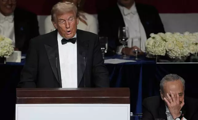 Republican presidential nominee former President Donald Trump speaks at the 79th annual Alfred E. Smith Memorial Foundation Dinner, Thursday, Oct. 17, 2024, in New York, as Senate Majority Leader Chuck Schumer of N.Y., listens. (AP Photo/Julia Demaree Nikhinson)