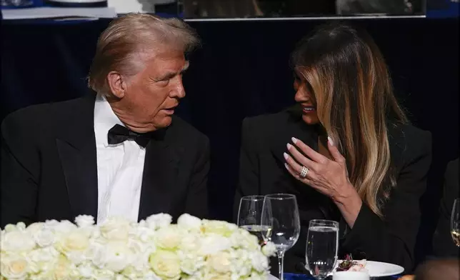 Republican presidential nominee former President Donald Trump and former first lady Melania Trump talk at the 79th annual Alfred E. Smith Memorial Foundation Dinner, Thursday, Oct. 17, 2024, in New York. (AP Photo/Julia Demaree Nikhinson)