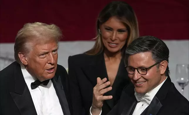 Republican presidential nominee former President Donald Trump, former first lady Melania Trump and House Speaker Mike Johnson of La., attend the 79th annual Alfred E. Smith Memorial Foundation Dinner, Thursday, Oct. 17, 2024, in New York. (AP Photo/Julia Demaree Nikhinson)