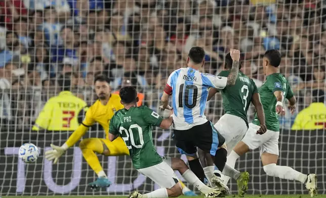 Argentina's Lionel Messi scores his side's sixth goal against Bolivia during a World Cup 2026 qualifying soccer match at Monumental stadium in Buenos Aires, Argentina, Tuesday, Oct. 15, 2024. (AP Photo/Natacha Pisarenko)