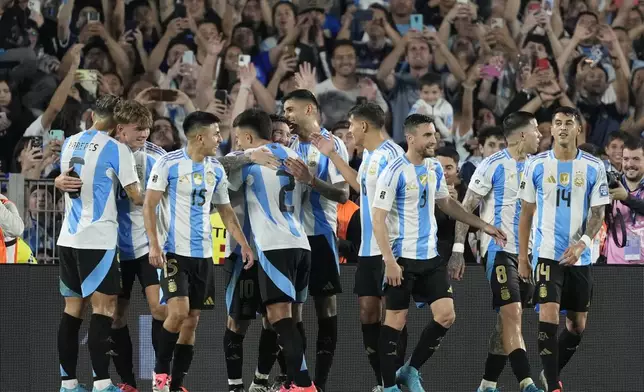 Argentina's player celebrate after Lionel Messi scored their sixth goal against Bolivia during a World Cup 2026 qualifying soccer match at Monumental stadium in Buenos Aires, Argentina, Tuesday, Oct. 15, 2024. (AP Photo/Natacha Pisarenko)