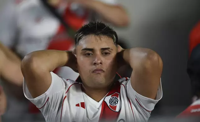 A fan of Argentina's River Plate looks on at the end of a Copa Libertadores semifinal second leg soccer match against Brazil's Atletico Mineiro at Monumental stadium in Buenos Aires, Argentina, Tuesday, Oct. 29, 2024. Atletico Mineiro won 3-0 on aggregate. (AP Photo/Gustavo Garello)