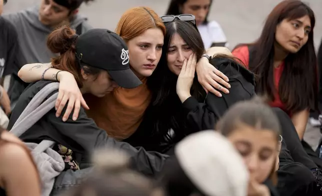 Fans of former One Direction singer Liam Payne gather at the Obelisk to honor him one day after he was found dead at a hotel in Buenos Aires, Argentina, Thursday, Oct. 17, 2024. (AP Photo/Natacha Pisarenko)