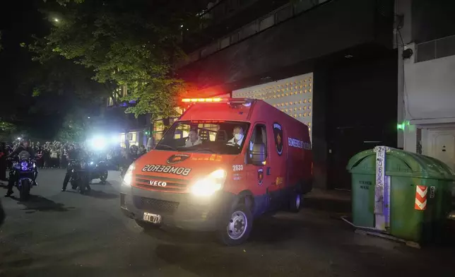 An ambulance carrying the body former One Direction singer Liam Payne leaves the hotel where he was found dead after he fell from a balcony in Buenos Aires, Argentina, Wednesday, Oct. 16, 2024. (AP Photo/Natacha Pisarenko)