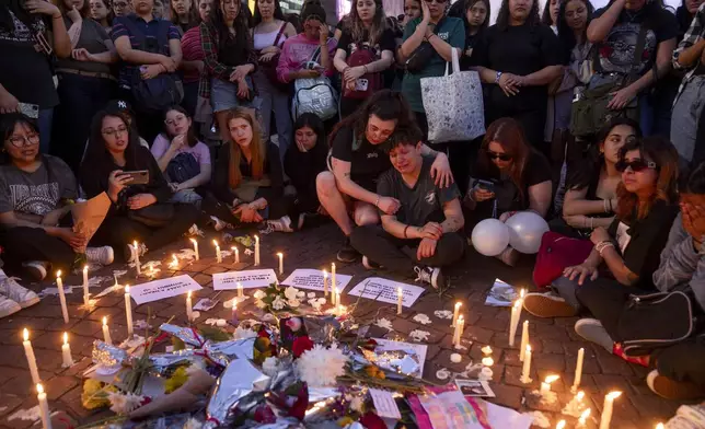 Fans of former One Direction singer Liam Payne gather at the Obelisk to honor him one day after he was found dead at a hotel in Buenos Aires, Argentina, Thursday, Oct. 17, 2024. (AP Photo/Victor R. Caivano)