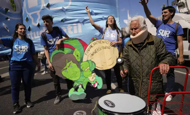 Aidé García, a retiree, joins students protesting outside Congress as lawmakers debate President Javier Milei's veto of a law to increase funding for public universities in Buenos Aires, Argentina, Wednesday, Oct. 9, 2024. (AP Photo/Rodrigo Abd)