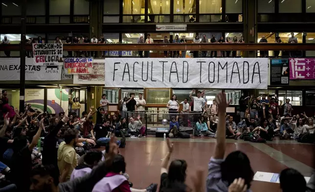 Students gather at the University of Buenos Aires to brainstorm ways to protest President Javier Milei's veto of a law to increase funding for public universities in Buenos Aires, Argentina, Wednesday, Oct. 16, 2024. (AP Photo/Natacha Pisarenko)