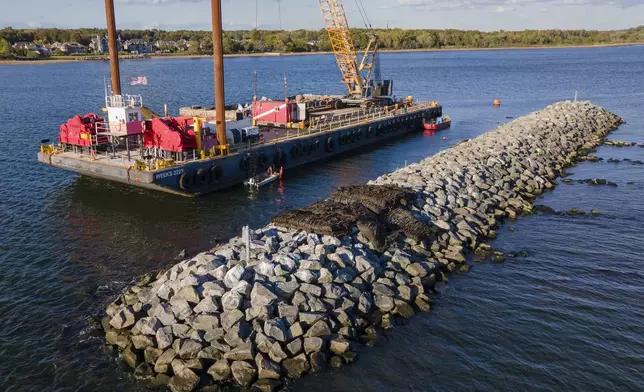 Construction is wrapping up on eight eco-friendly "Living Breakwaters" at the southernmost tip of New York City, off the coast of Staten Island, Wednesday, Oct. 9, 2024. (AP Photo/Ted Shaffrey)