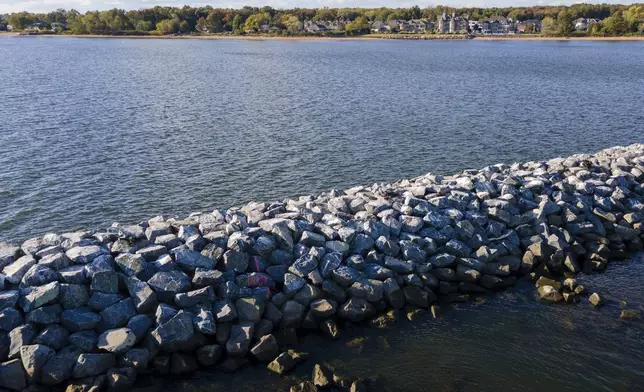 Construction is wrapping up on eight, eco-friendly "Living Breakwaters" at the southernmost tip of New York City, off the coast of Staten Island, Wednesday, Oct, 9, 2024, where artificial reefs were constructed as part of a strategy to reduce risk from hurricanes after Superstorm Sandy pummeled the region in 2012. (AP Photo/Ted Shaffrey)