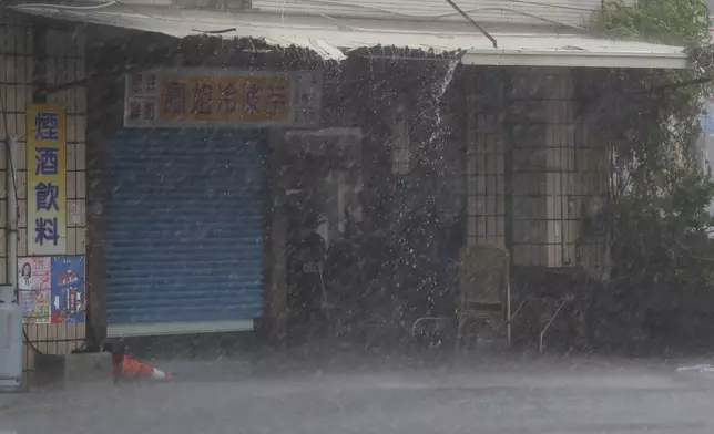 Wind and rain blow through Kaohsiung, southern Taiwan, as Typhoon Krathon arrives Thursday, Oct. 3, 2024. (AP Photo/Chiang Ying-ying)