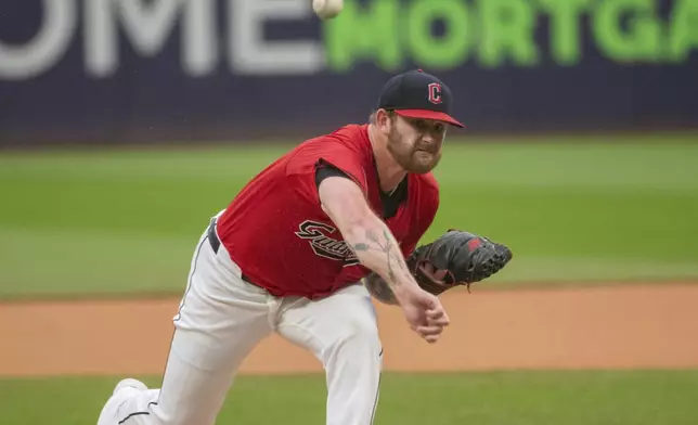 Cleveland Guardians starting pitcher Ben Lively delivers against the Houston Astros during the first inning of a baseball game in Cleveland, Saturday, Sept. 28, 2024. (AP Photo/Phil Long)