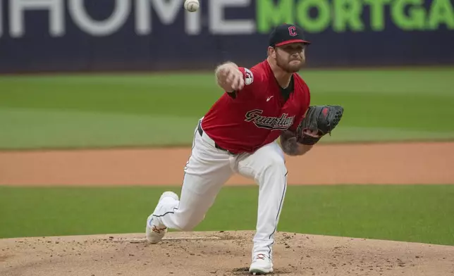 Cleveland Guardians starting pitcher Ben Lively delivers against the Houston Astros during the first inning of a baseball game in Cleveland, Saturday, Sept. 28, 2024. (AP Photo/Phil Long)