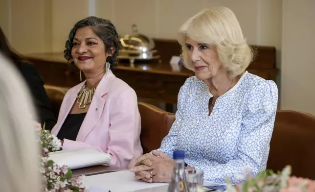 Queen Camilla, right, takes part in a discussion on family and domestic violence at Government House in Yarralumla at Canberra, Australia, Monday, Oct. 21, 2024. (Brook Mitchell/Pool Photo via AP)