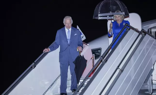 Britain's King Charles III and Queen Camilla arrive in Sydney for the start of a five day tour to Australia, Friday, Oct. 18, 2024. (Brook Mitchell/Pool Photo via AP)