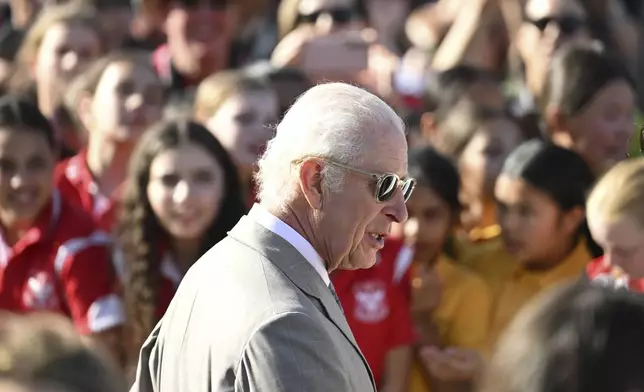 Britain's King Charles III meets members of the public during a visit to the Sydney Opera House on Tuesday Oct. 22, 2024 in Sydney, Australia. (Roni Bintang/Pool Photo via AP)